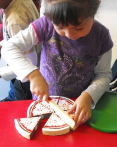 Child working with preschool snacks